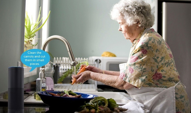 Senior Woman Using Alexa For Cooking